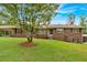 Charming single-story brick home with well-manicured lawn and mature landscaping at 597 Rich Davis Rd, Hiram, GA 30141