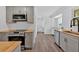 Well-designed kitchen with butcher block countertops, gray cabinets, and stainless steel appliances at 597 Rich Davis Rd, Hiram, GA 30141