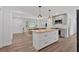 Bright, open kitchen featuring a butcher block island with pendant lights and stainless steel appliances at 597 Rich Davis Rd, Hiram, GA 30141