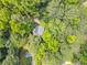 Aerial view of home surrounded by green trees and lush landscape at 6360 Lakeview Ter, Douglasville, GA 30135
