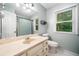 Bathroom featuring a vanity with countertop and a window with natural light at 6360 Lakeview Ter, Douglasville, GA 30135
