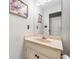 Bathroom features a marble countertop sink and cabinet with white walls at 6360 Lakeview Ter, Douglasville, GA 30135
