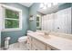 Bathroom featuring a vanity with countertop and a window with natural light at 6360 Lakeview Ter, Douglasville, GA 30135