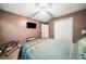 Bedroom featuring carpet, a ceiling fan, and a window with natural light at 6360 Lakeview Ter, Douglasville, GA 30135
