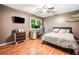 Bedroom featuring carpet, a ceiling fan, and a window with natural light at 6360 Lakeview Ter, Douglasville, GA 30135