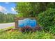 Entrance sign for Sweetwater Bluff showcasing the community's name, surrounded by landscaping at 6360 Lakeview Ter, Douglasville, GA 30135