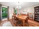 Formal dining room features wood floors, wainscoting, and a large window with wooded views at 6360 Lakeview Ter, Douglasville, GA 30135