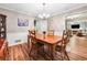 Traditional dining room with wood floors, a large window, and neutral wall paint at 6360 Lakeview Ter, Douglasville, GA 30135