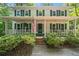 Charming two-story home features a inviting front porch with a swing and an American flag at 6360 Lakeview Ter, Douglasville, GA 30135
