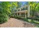 Traditional two-story home with a welcoming front porch and well-maintained landscaping at 6360 Lakeview Ter, Douglasville, GA 30135