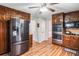 The kitchen has stainless steel appliances, wood cabinets, wood-look floors, and double ovens at 6360 Lakeview Ter, Douglasville, GA 30135