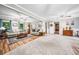 Open-concept living space with hardwood floors and views into other rooms of the house at 6360 Lakeview Ter, Douglasville, GA 30135