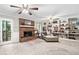 Cozy living area features a brick fireplace, built-in shelving, and a comfortable armchair at 6360 Lakeview Ter, Douglasville, GA 30135