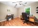 Home office featuring wood floors, a desk, and a window with natural light at 6360 Lakeview Ter, Douglasville, GA 30135