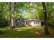 Home with well-maintained backyard, mature trees, and inviting curb appeal at 1002 Forrest Blvd, Decatur, GA 30030