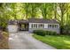 Exterior view of home with front yard, driveway and 1-car garage at 1002 Forrest Blvd, Decatur, GA 30030