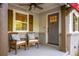 Inviting covered front porch with comfortable seating, ceiling fan, and stylish door at 1002 Forrest Blvd, Decatur, GA 30030