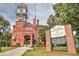 The Gwinnett Historic Courthouse made of brick and features a tall tower and a flagpole at 2413 Malster Ln, Lawrenceville, GA 30043