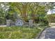 A welcoming entrance to Tribble Mill Park with brick pillars and stone signage, set amidst lush greenery at 2413 Malster Ln, Lawrenceville, GA 30043