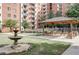 Gazebo and fountain sit in a manicured courtyard with lush lawns, inviting residents to relax outdoors at 300 Johnson Ferry Rd # A614, Atlanta, GA 30328
