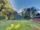 Exterior view showing the home with a large, grassy yard at 7054 Chappell Cir, Atlanta, GA 30360