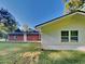 Exterior view showing the home with a large, grassy yard at 7054 Chappell Cir, Atlanta, GA 30360