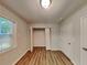 Bright bedroom features wood-look flooring, a window, and a closet at 7054 Chappell Cir, Atlanta, GA 30360