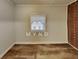 Bedroom featuring wood-look floors and neutral walls with a window at 7054 Chappell Cir, Atlanta, GA 30360