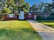 Charming brick home with a well-manicured lawn and classic architectural details at 7054 Chappell Cir, Atlanta, GA 30360