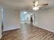 Inviting living space with a ceiling fan, built-in shelving, and wood-look flooring at 7054 Chappell Cir, Atlanta, GA 30360
