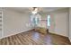 Bright living room featuring stylish flooring, a ceiling fan, and ample natural light at 7054 Chappell Cir, Atlanta, GA 30360