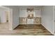 Cozy room featuring wood-look floors and a decorative brick fireplace surround at 7054 Chappell Cir, Atlanta, GA 30360