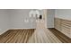 Spacious living area with wood-look flooring and a decorative wood accent wall at 7054 Chappell Cir, Atlanta, GA 30360