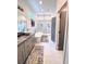 Bright bathroom with double sinks, modern shower, and soaking tub at 1463 Macklone Ne St, Atlanta, GA 30307