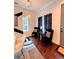 Cozy dining area with modern chandelier, dark chairs, and black and white decor accents at 1463 Macklone Ne St, Atlanta, GA 30307