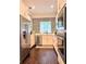 Well-lit kitchen with stainless steel appliances, mosaic backsplash, and ample counter space at 1463 Macklone Ne St, Atlanta, GA 30307