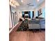 Bright living room with a gray sectional, fireplace, and striking black and white striped accent wall at 1463 Macklone Ne St, Atlanta, GA 30307