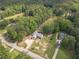 Scenic aerial view captures the peaceful, wooded surroundings of two homes on the property at 1623 Pratt Rd, Covington, GA 30014