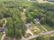 Expansive aerial view of a wooded property featuring two homes and ample land at 1623 Pratt Rd, Covington, GA 30014