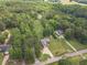 Aerial view of a home featuring a long driveway and surrounding by lush greenery, offering privacy and space at 1623 Pratt Rd, Covington, GA 30014