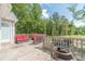 Back deck with a relaxing seating area, outdoor fire pit and beautiful backyard views at 1623 Pratt Rd, Covington, GA 30014