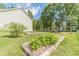 Well-maintained backyard with raised garden beds and a play area, ideal for gardening and Gathering entertainment at 1623 Pratt Rd, Covington, GA 30014