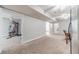 Open basement floor plan with carpeted flooring, natural light, and multiple rooms at 1623 Pratt Rd, Covington, GA 30014