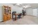 Finished basement with carpeted flooring features a desk, workspace, and appliances at 1623 Pratt Rd, Covington, GA 30014