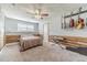 Cozy carpeted bedroom boasts guitars hung on the wall and rustic wood paneling at 1623 Pratt Rd, Covington, GA 30014