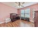 Charming Bedroom with wood floors, crib, and dresser at 1623 Pratt Rd, Covington, GA 30014