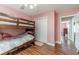 Bedroom features a bunk bed, wood laminate flooring, and closet with ample space at 1623 Pratt Rd, Covington, GA 30014
