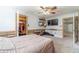 Bedroom features closet access, a mounted TV, and wood accent trim at 1623 Pratt Rd, Covington, GA 30014