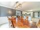 Spacious dining room with views to the kitchen and living room, plus a modern light fixture at 1623 Pratt Rd, Covington, GA 30014