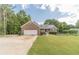 Charming single Gathering home with a beautiful front yard and a brick facade at 1623 Pratt Rd, Covington, GA 30014